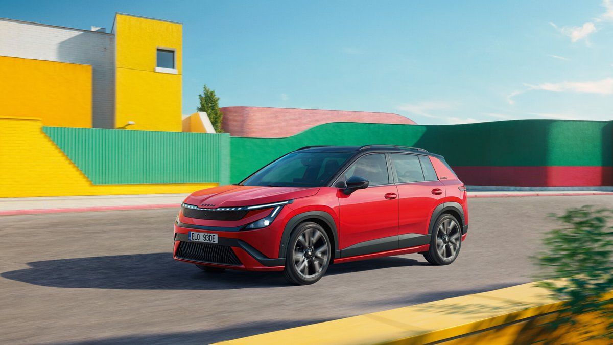 Škoda Epiq Sportline driving on the road with its LED light signature switched on